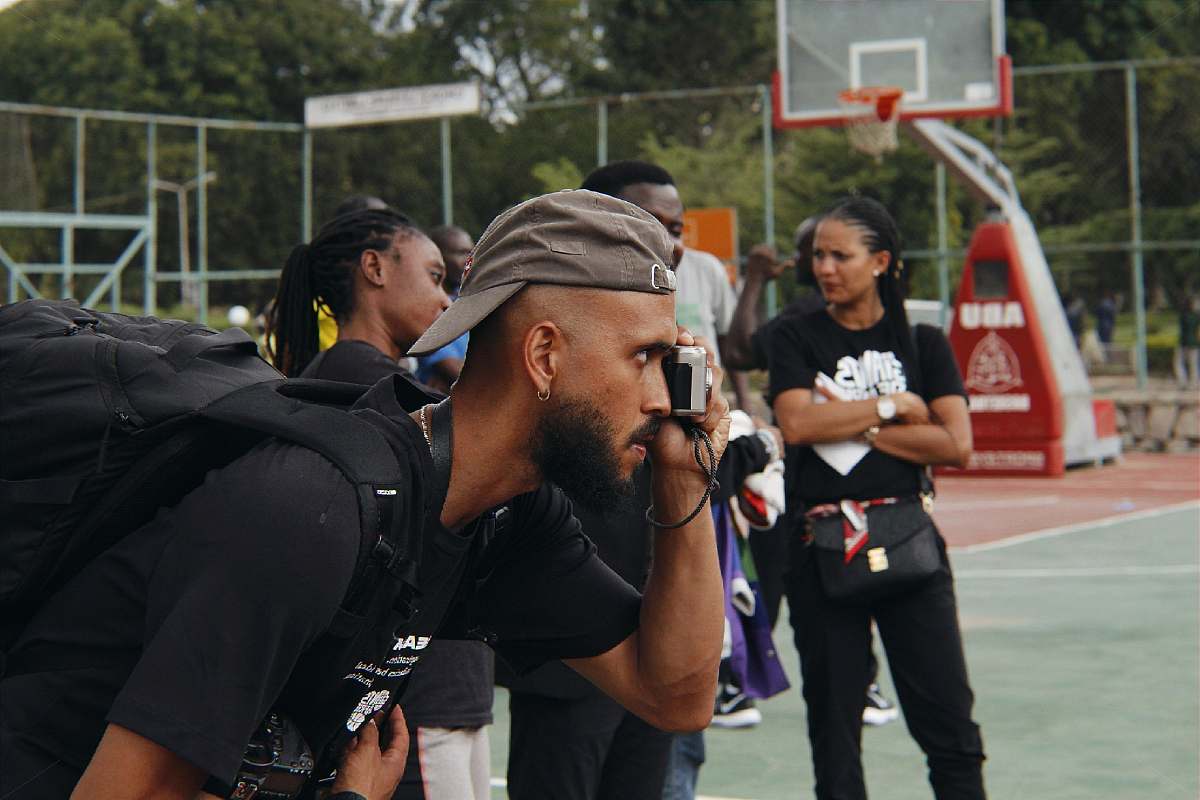 person man capturing photo people