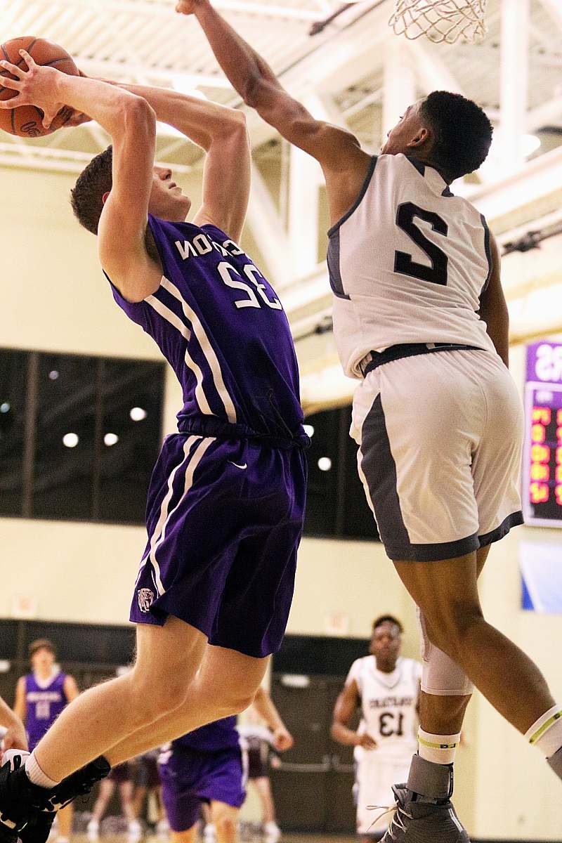 person man holding ball in mid-air apparel