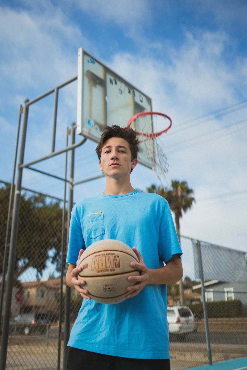 people man holding basketball ball close-up photography basketball