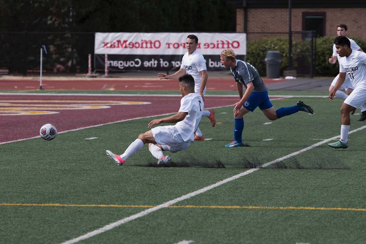 football man near soccer ball on turf soccer