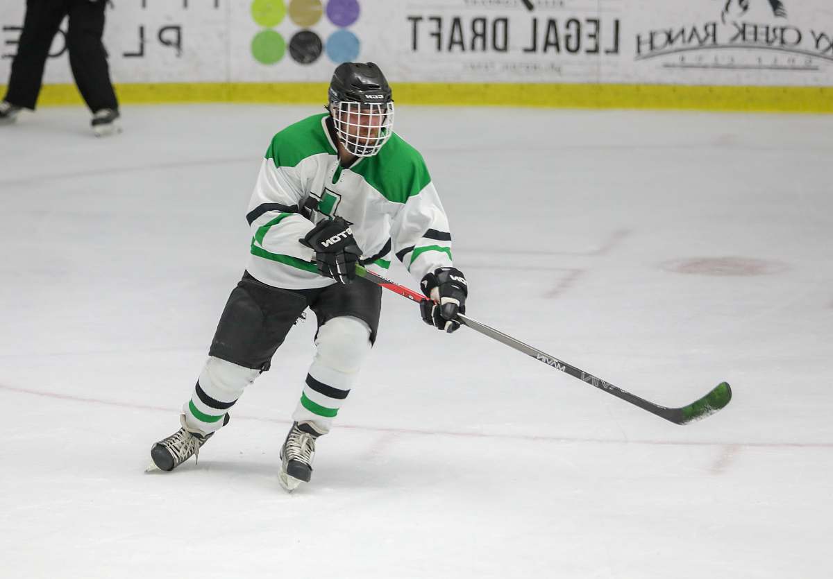 person man playing hockey helmet