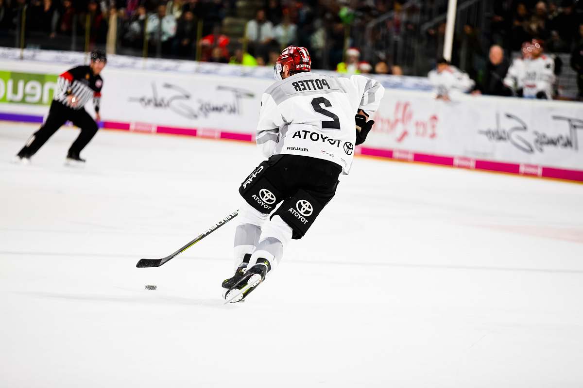 people man playing ice hockey on the field helmet