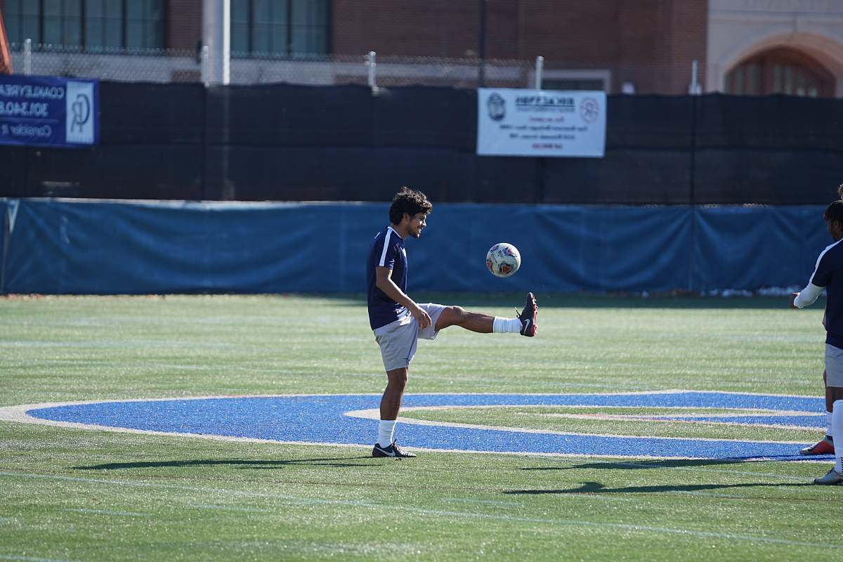 person man playing soccer ball people