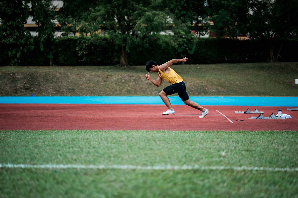person man running on field sport