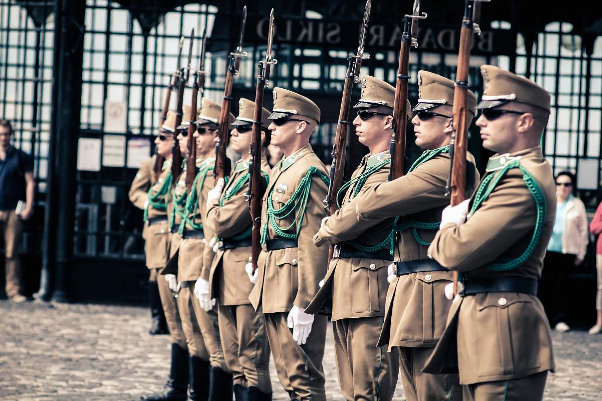 person men holding guns people