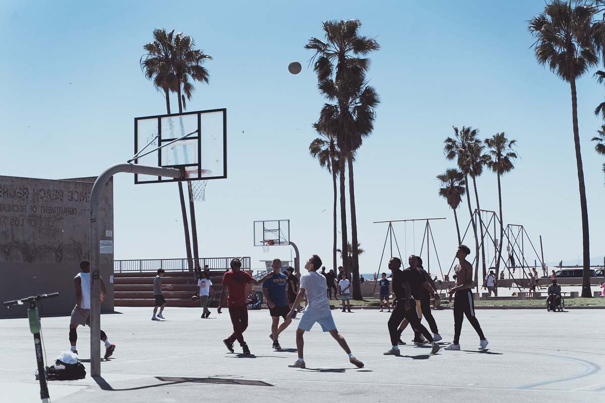 person men playing basketball during day people