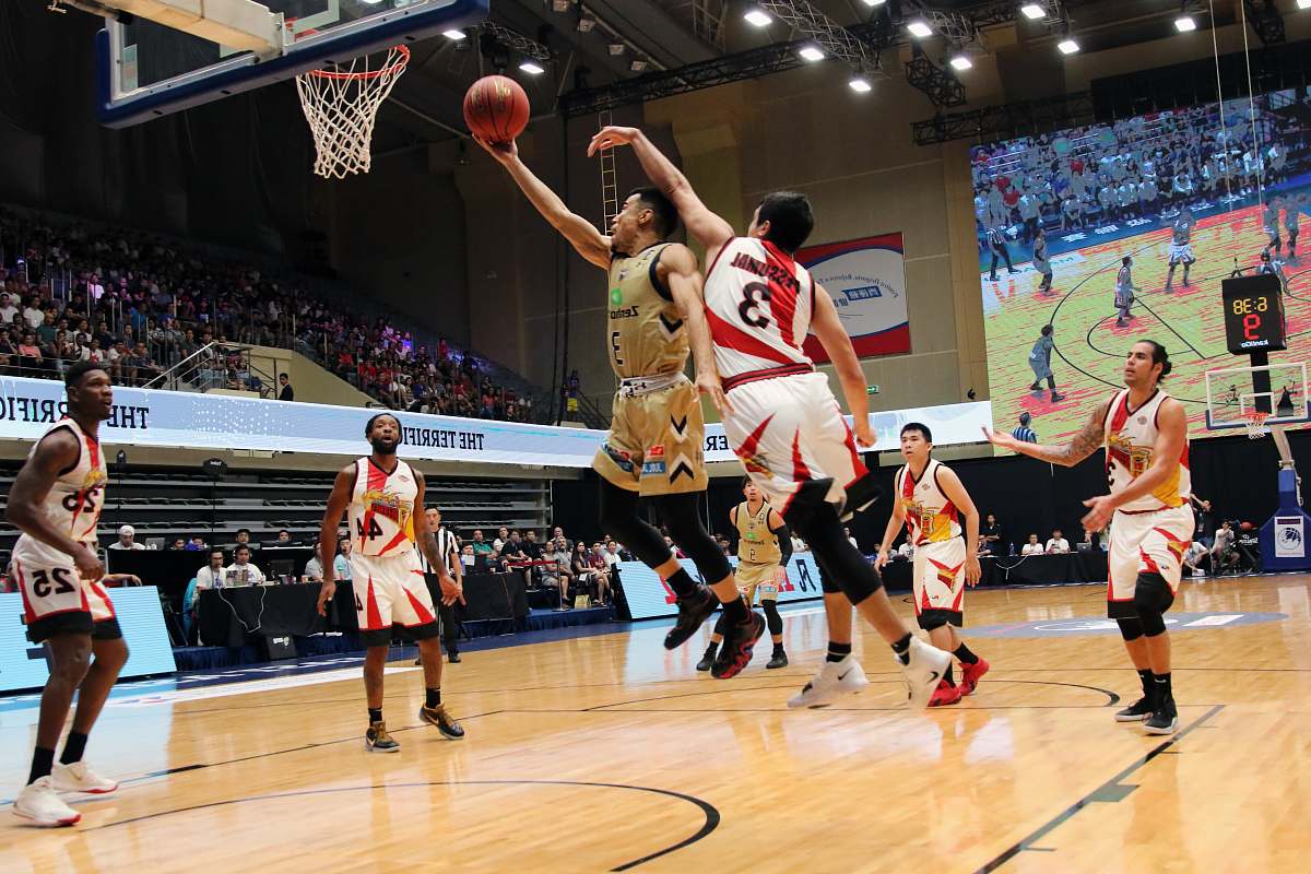 person men playing basketball inside building shoe