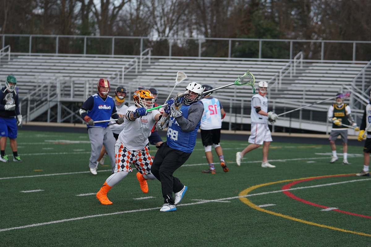 person men playing on field apparel