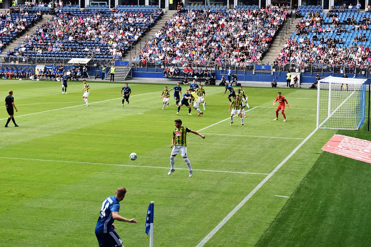 person men playing soccer of soccer field during daytime people