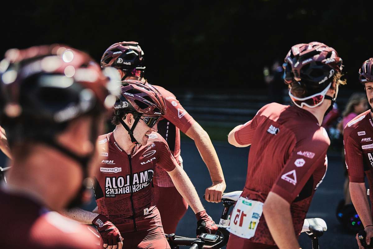 apparel men riding bicycles during daytime person