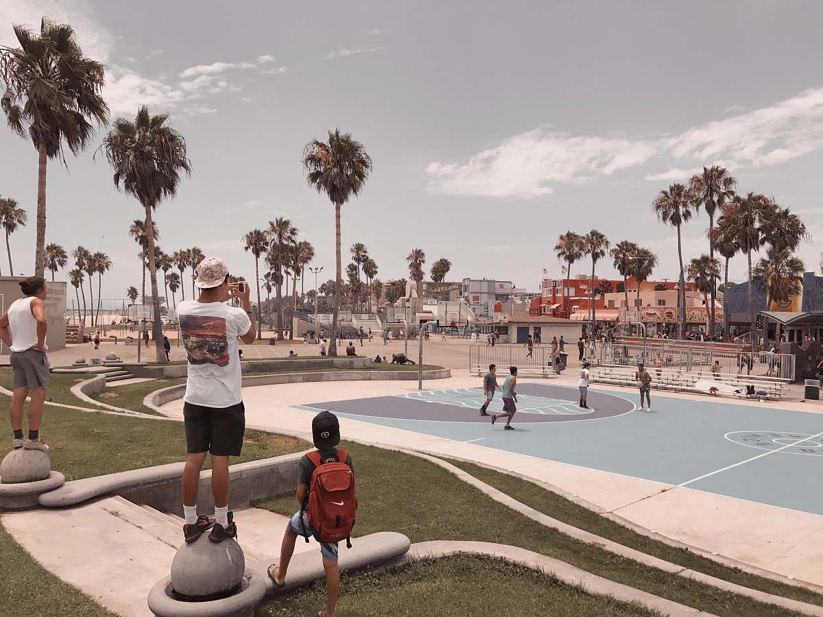 person people on basketball court during daytime building