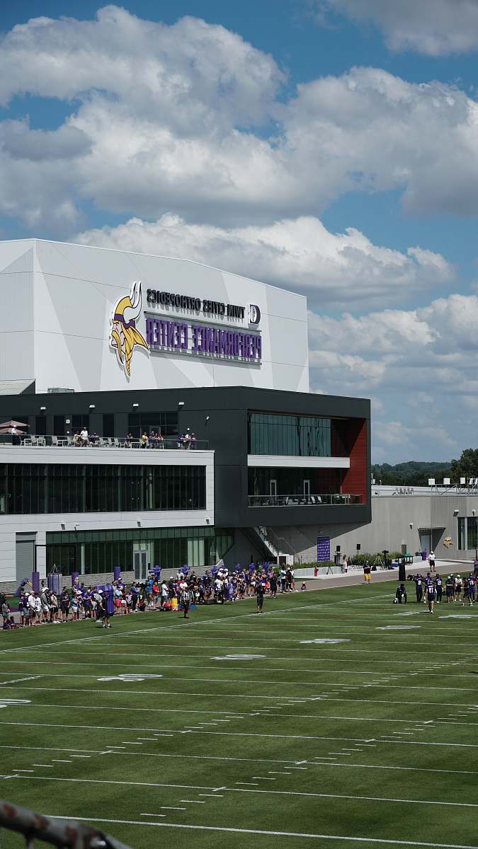 building people outside a football field field