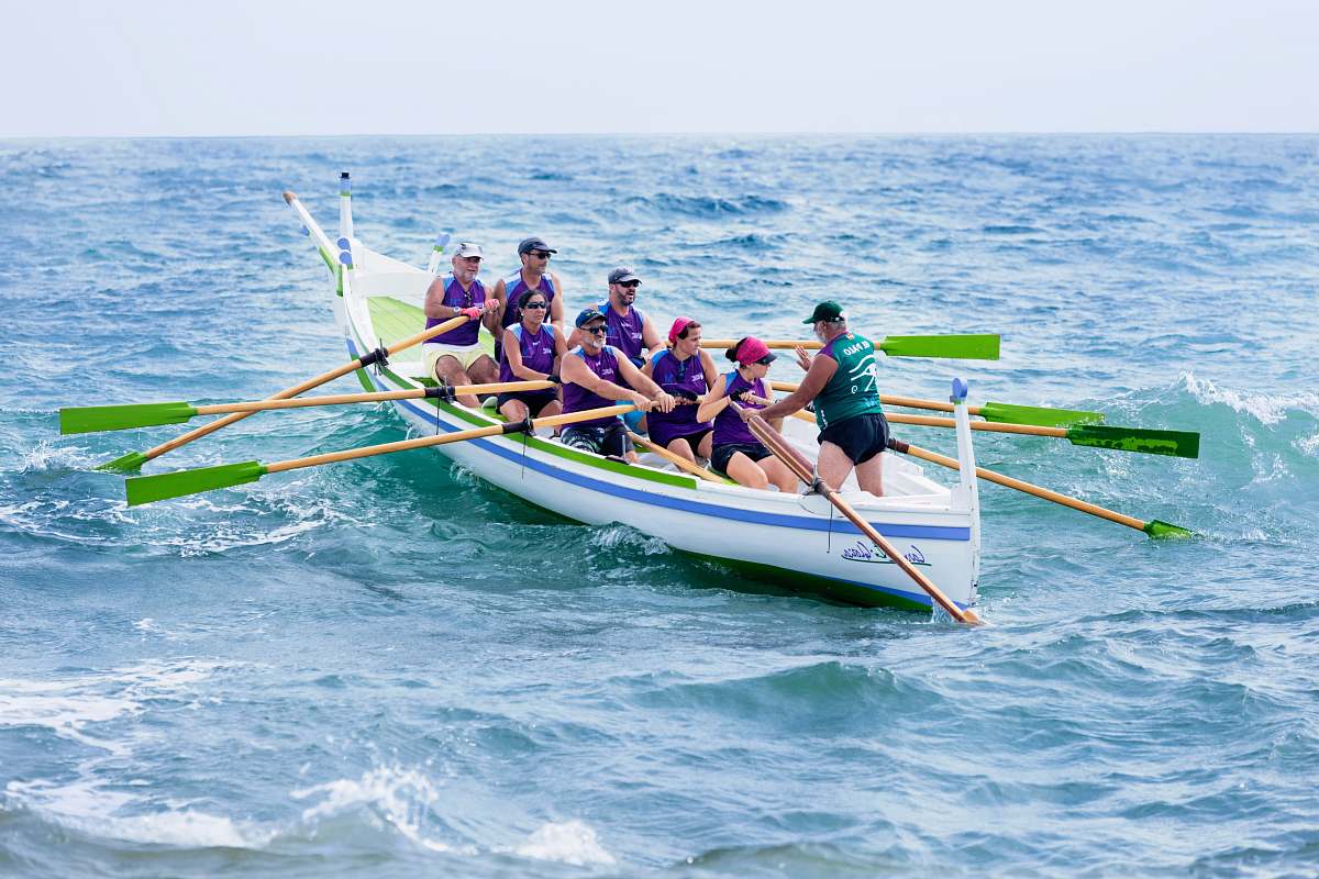 person people paddling on sea people