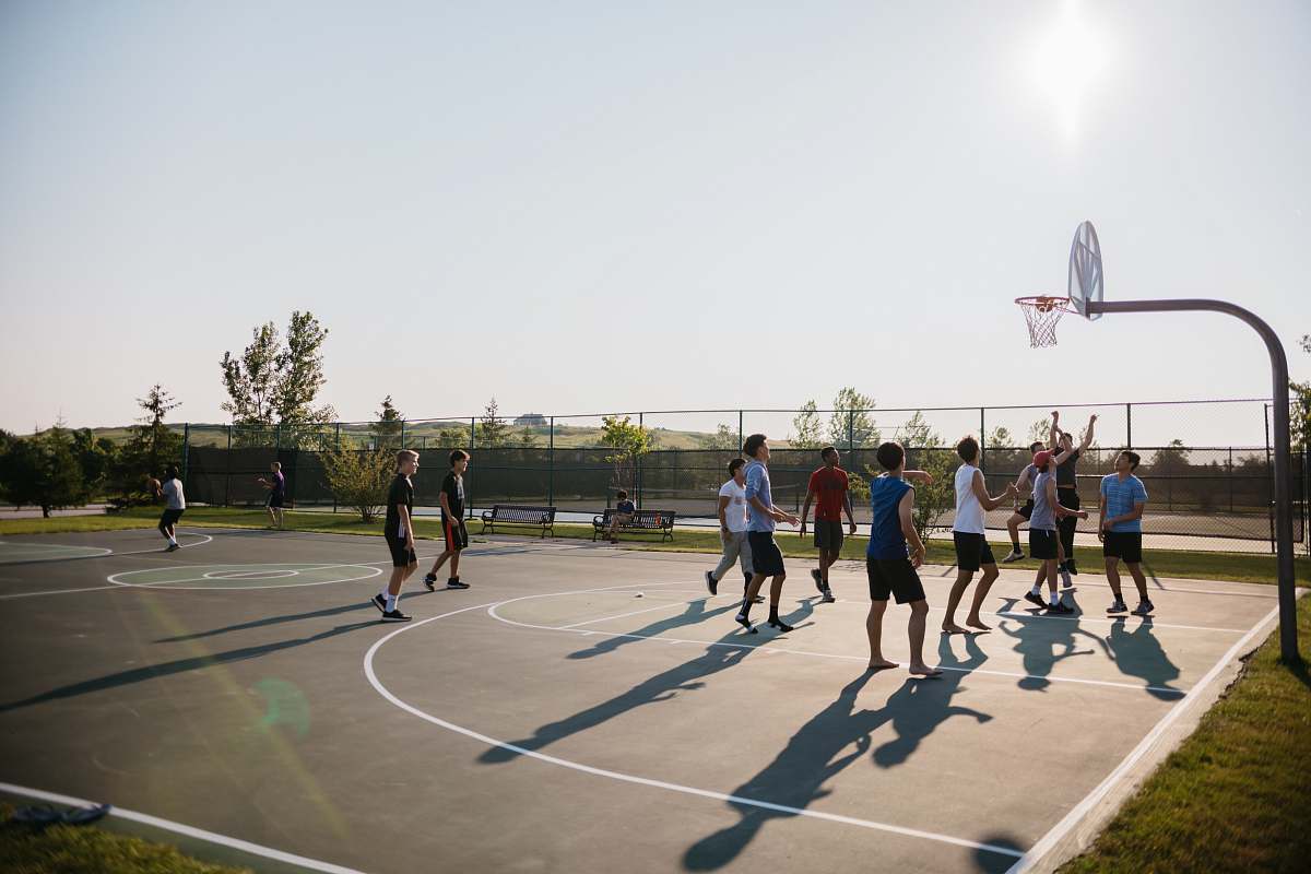 person people playing basket outside at daytime people