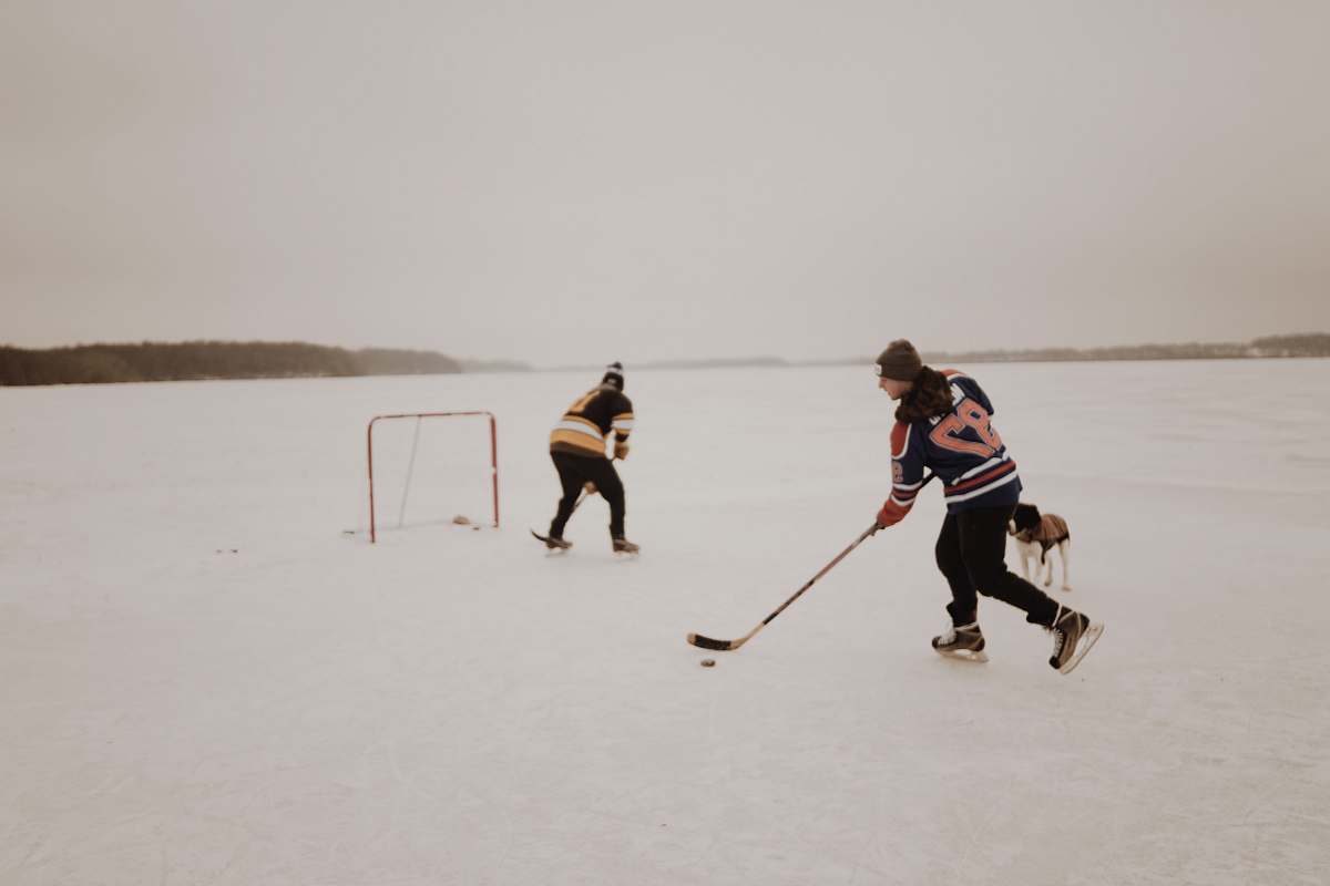person people playing ice hockey hockey