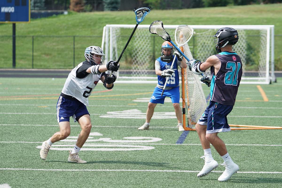 person people playing lacross sports apparel