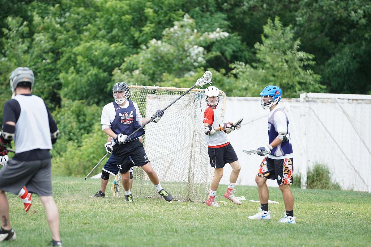 person people playing lacrosse apparel