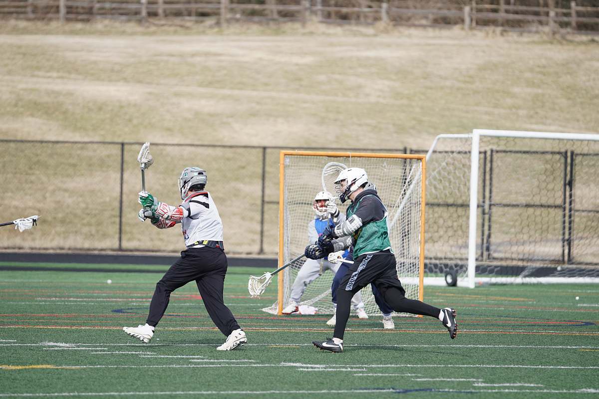 person people playing on field during daytime apparel