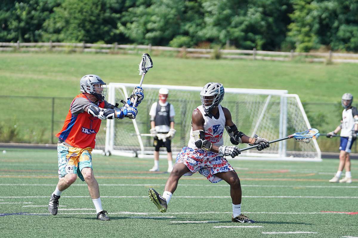 person people playing on grass field apparel