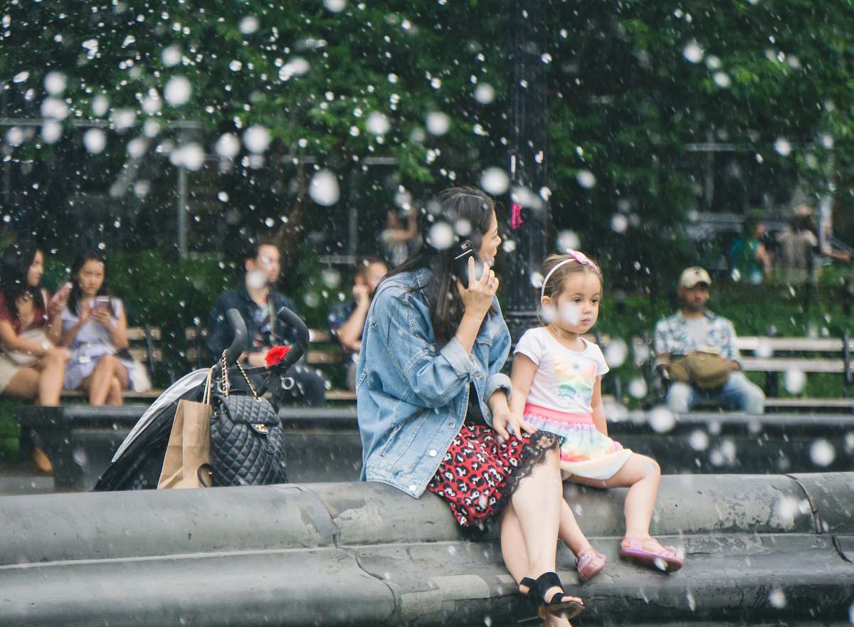 person people sitting on benches at the park apparel