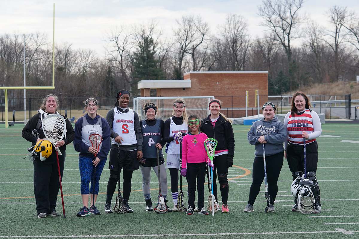person people standing on american football field people
