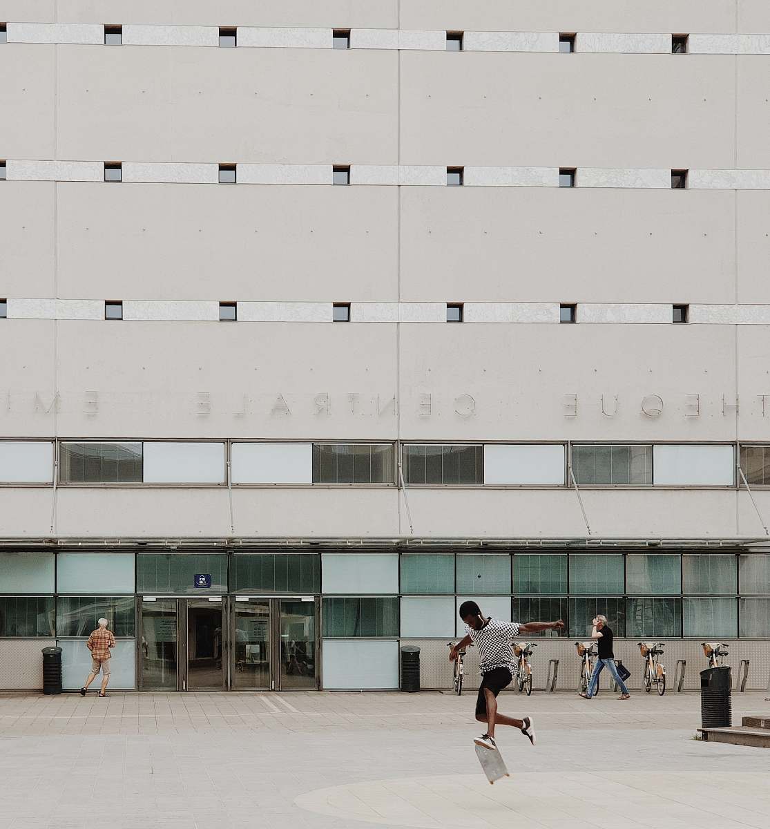 person people walking near building apparel