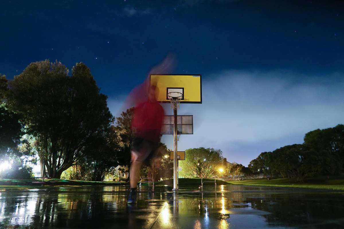 person person playing basketball in basketball court sport