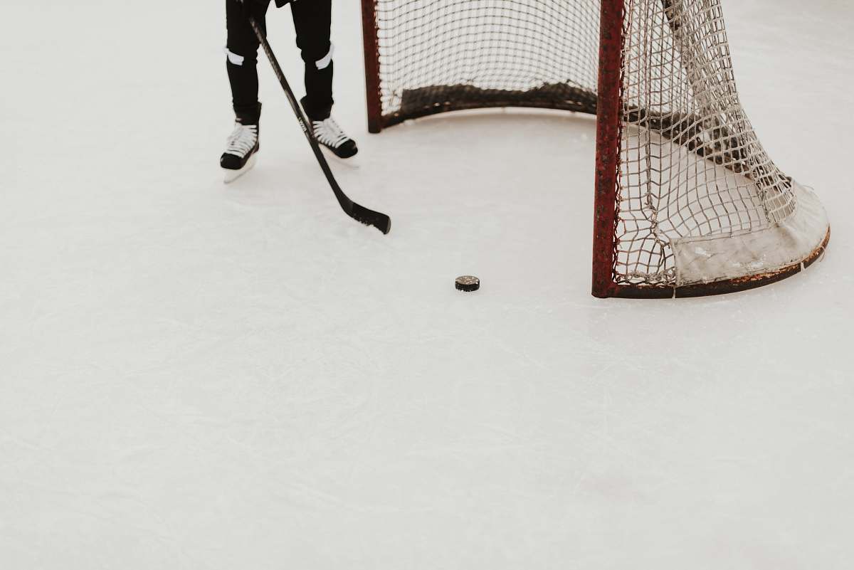 person person playing ice hockey people