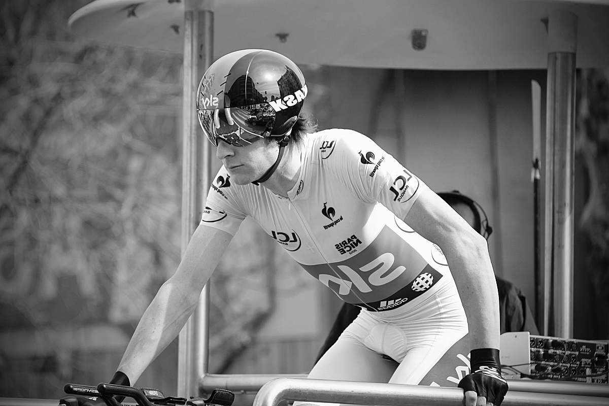 person person riding a bike black-and-white