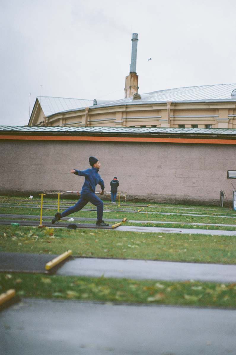 person person running on road near green field during daytime sport