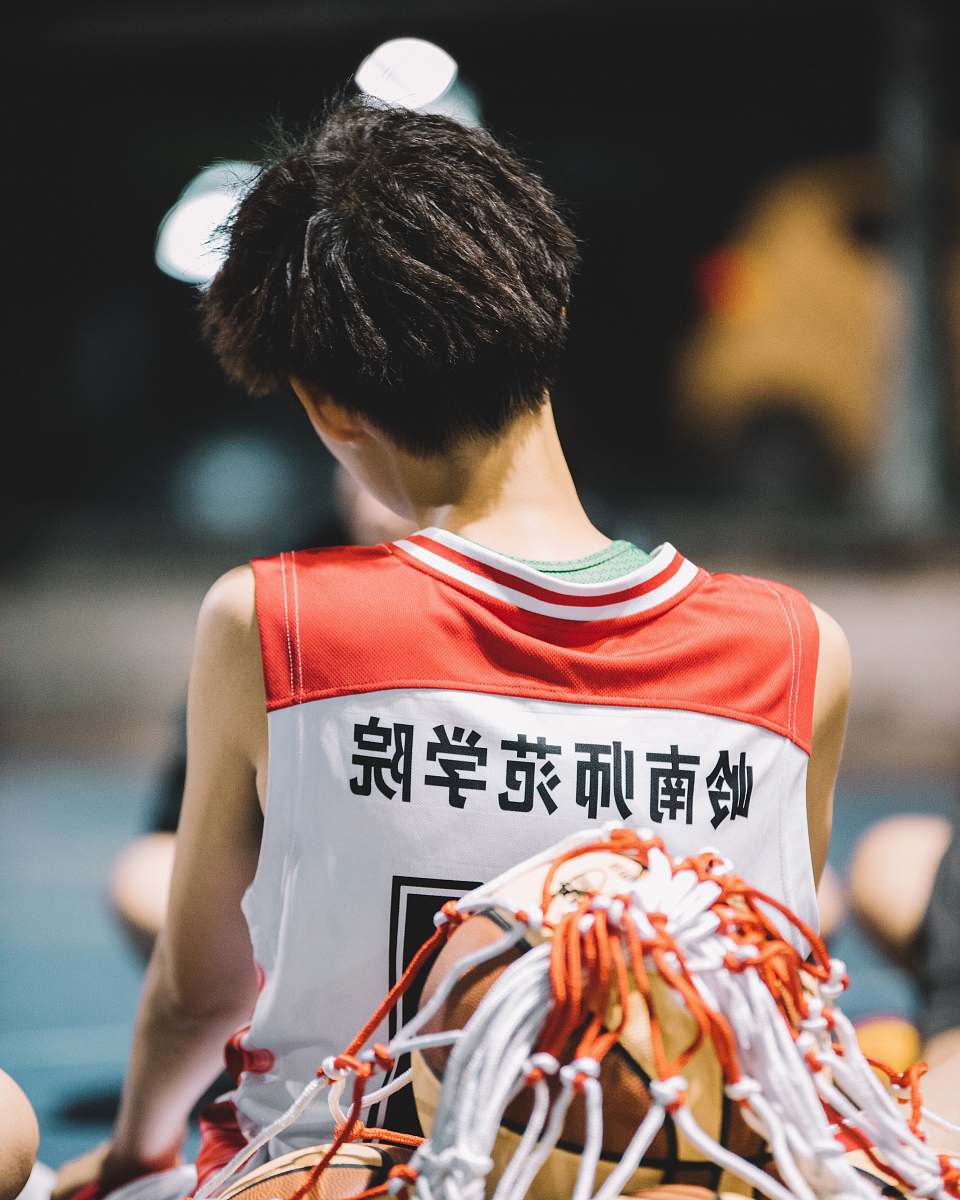 apparel person wearing red and white jersey clothing