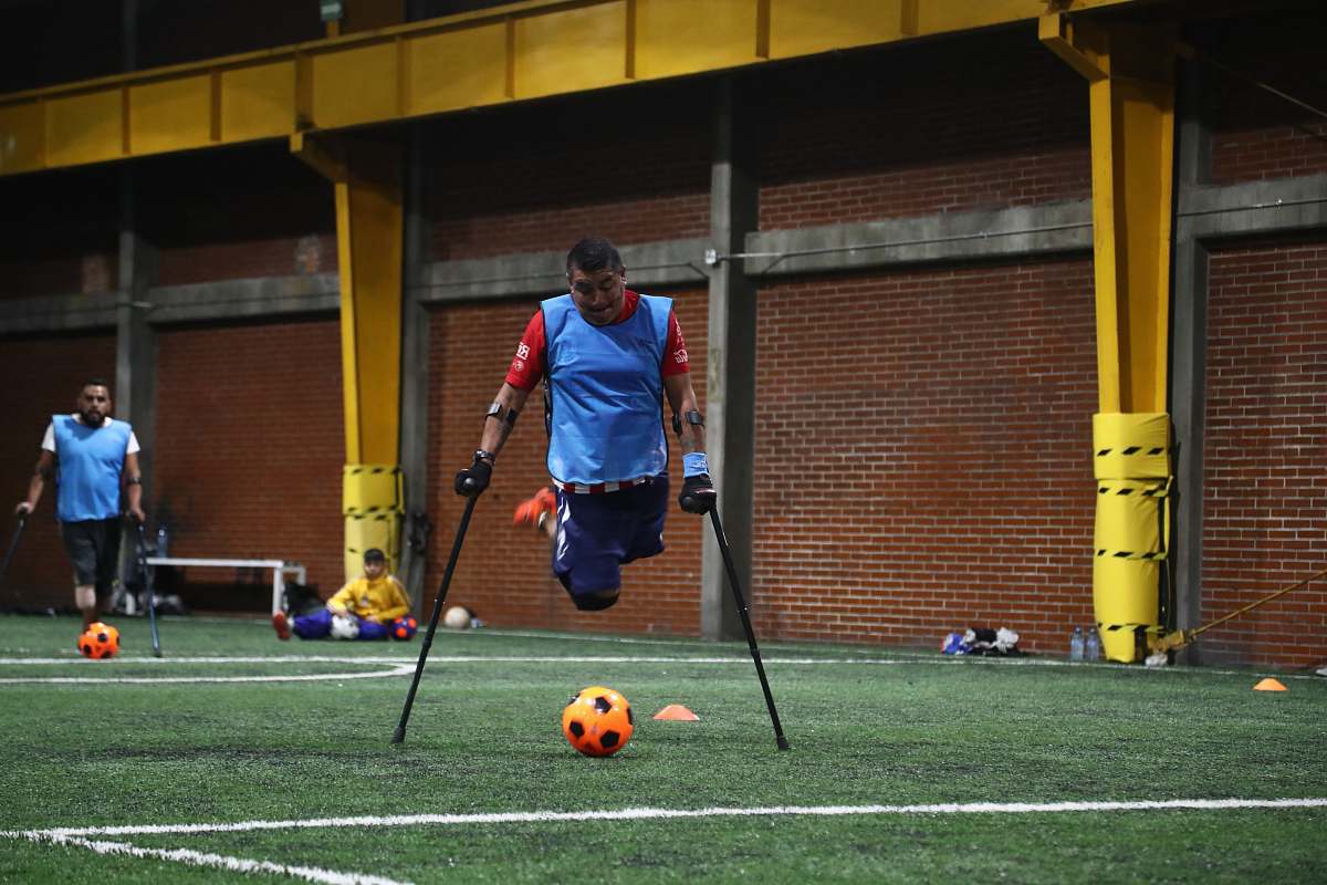person person with disability playing soccer people