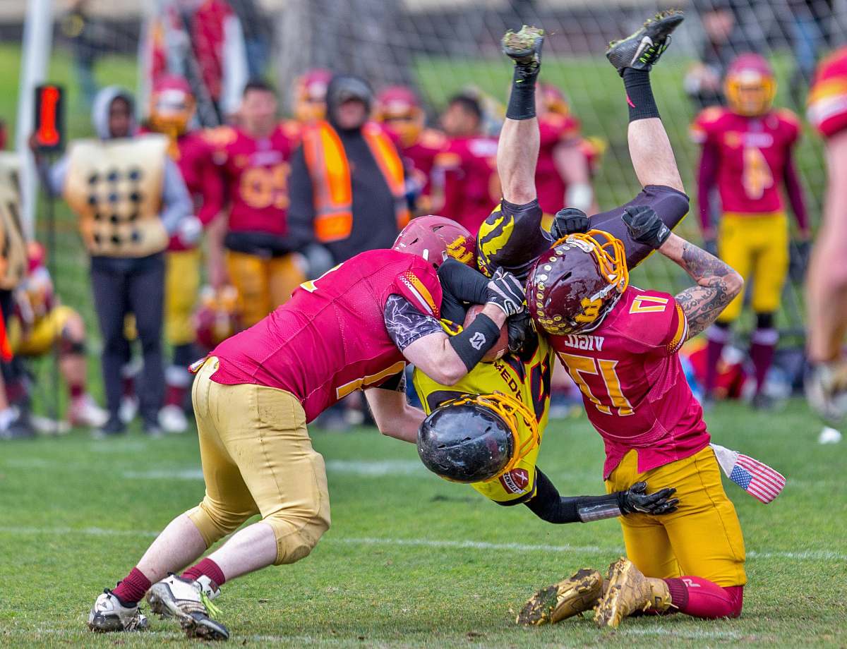 person photo of three men playing football people