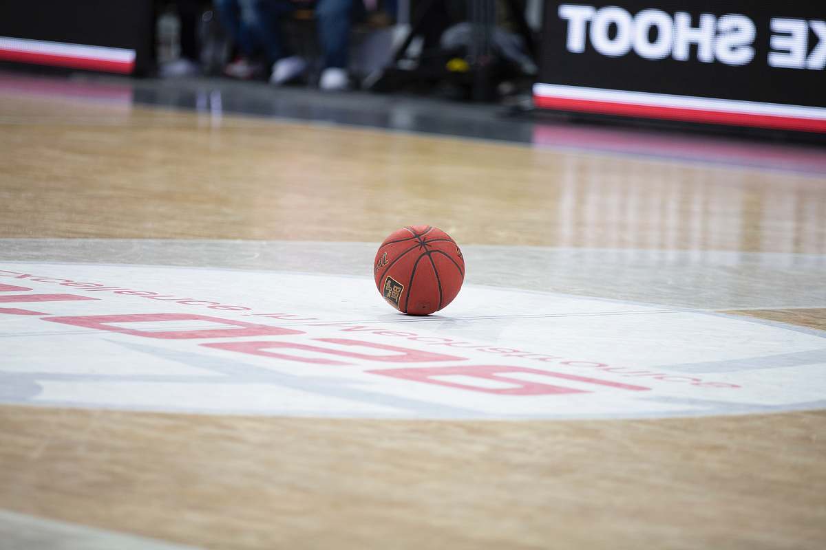 person red basketball on basketball court people