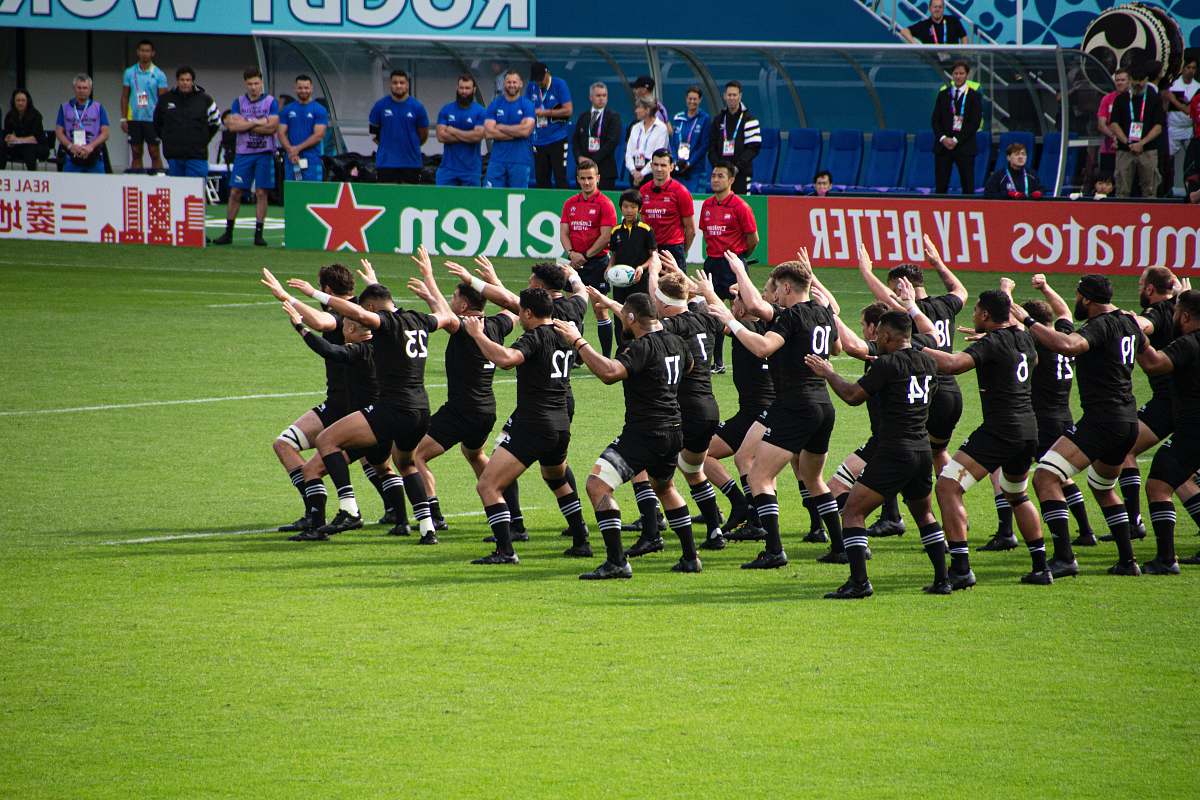 person rugby team dancing in the field people