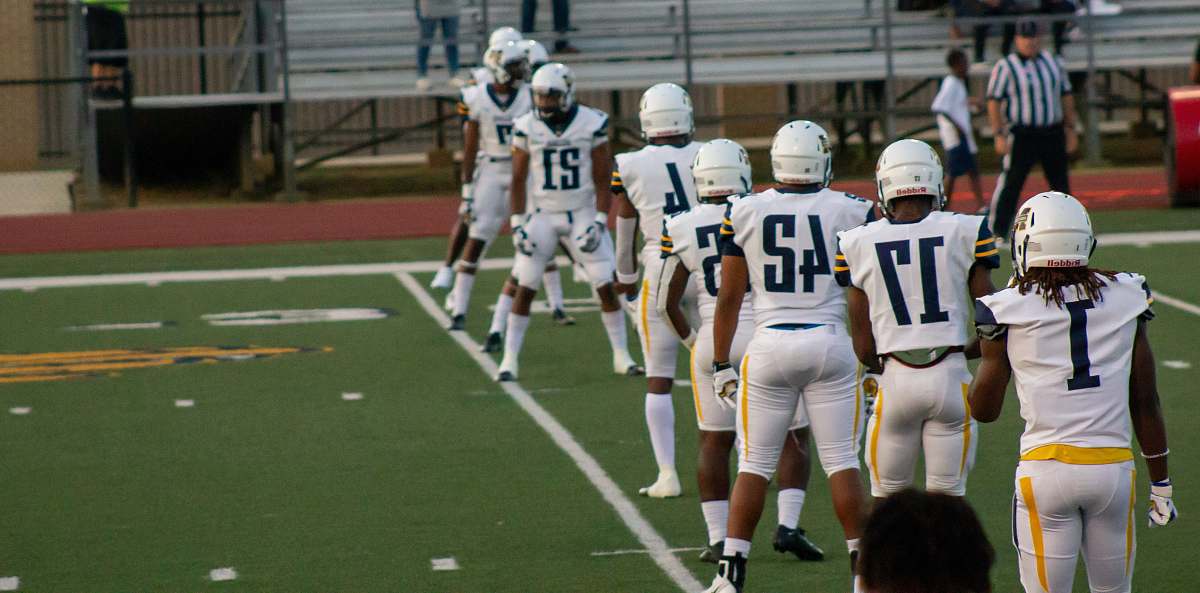 person shallow focus photo of football players apparel