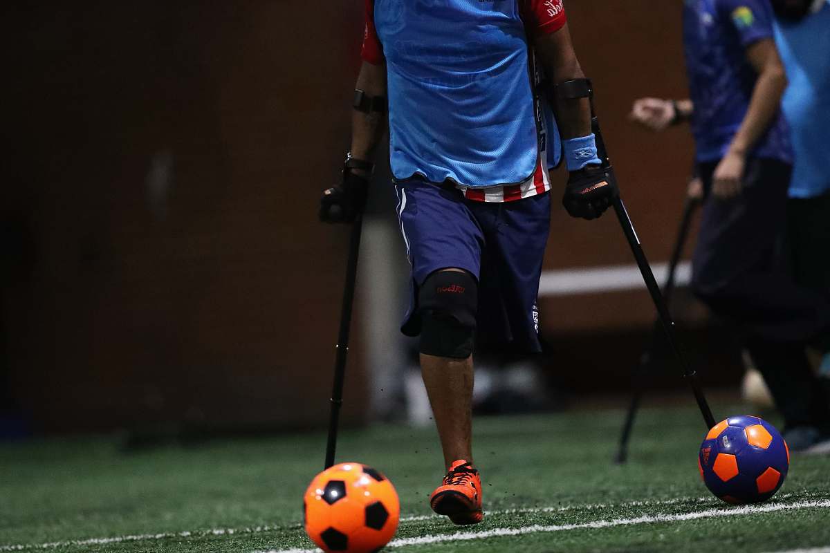 person shallow focus photo of person using black crutches apparel