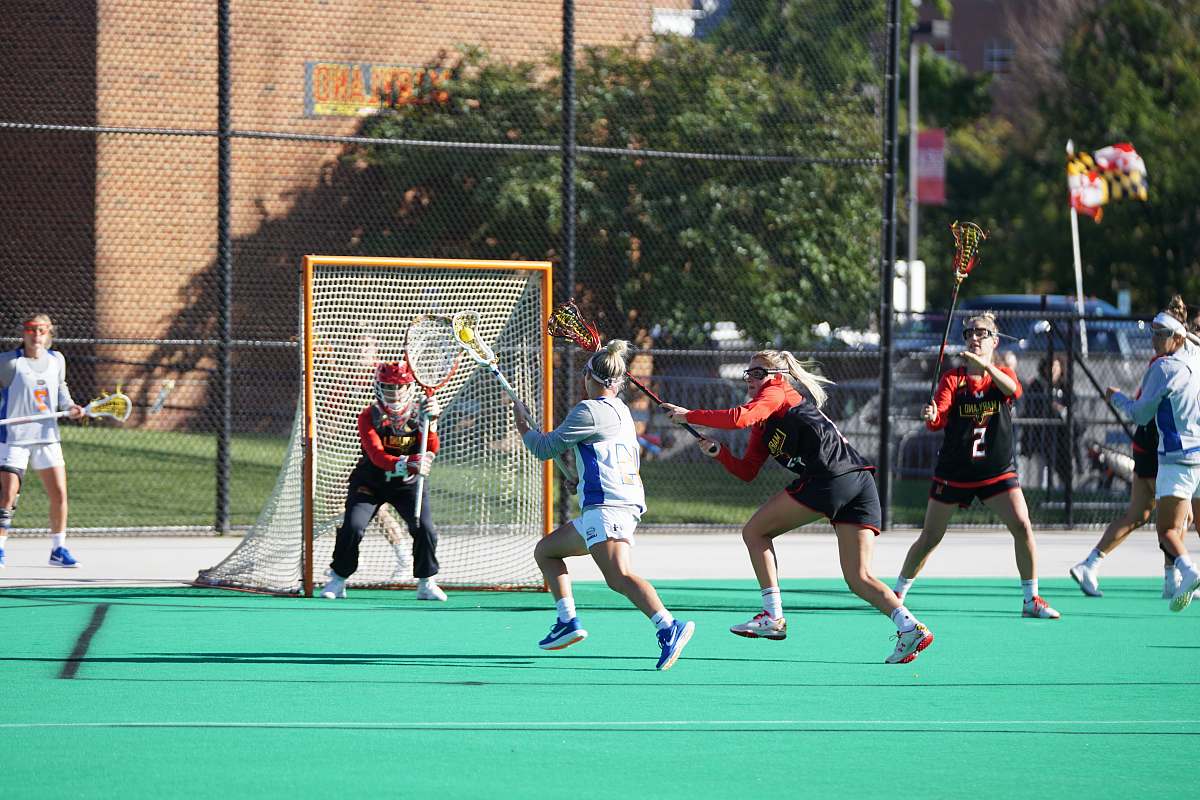 person six woman playing outdoor games hockey