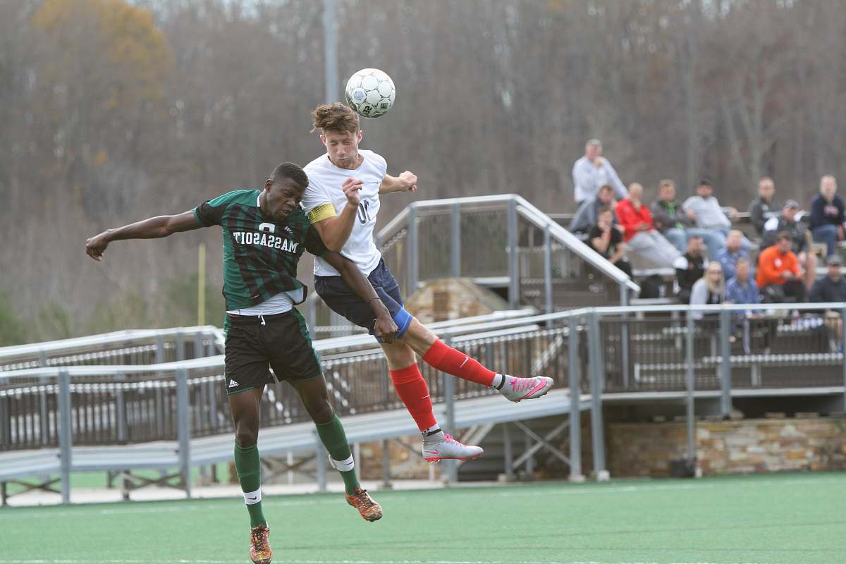 person soccer players jumping people