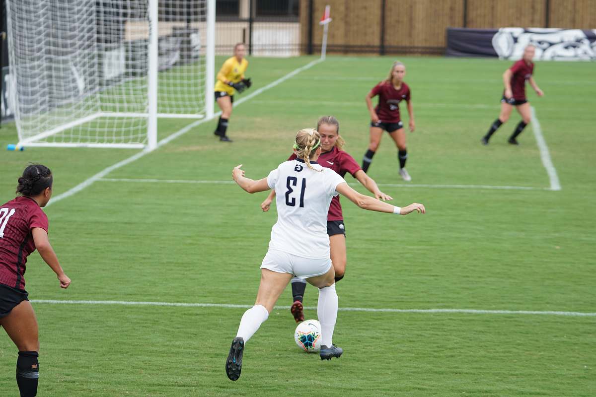 person team player playing on field people