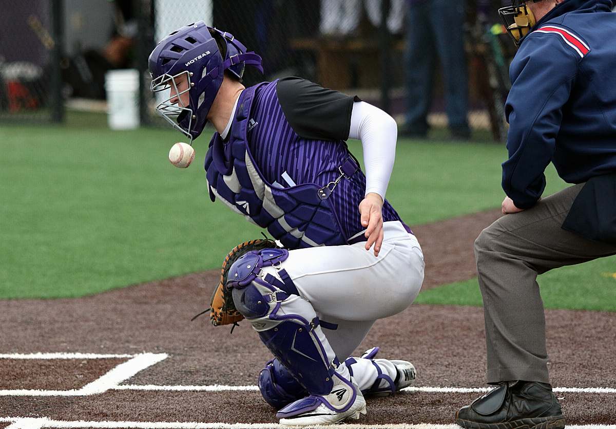 apparel time-lapse photography of baseball about to hit baseball catcher clothing