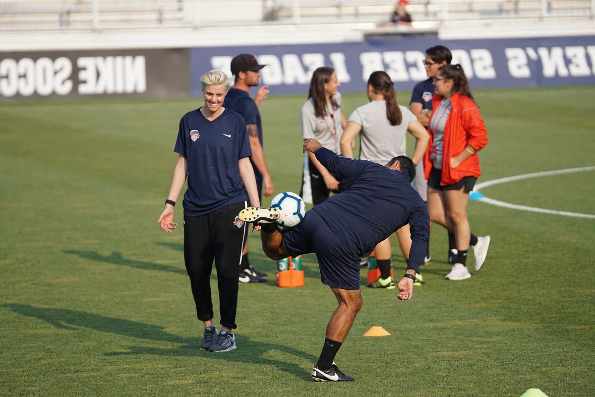 person time lapse photography of man doing tricks using soccer ball people