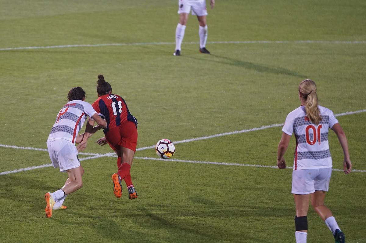 female white and black soccer ball woman