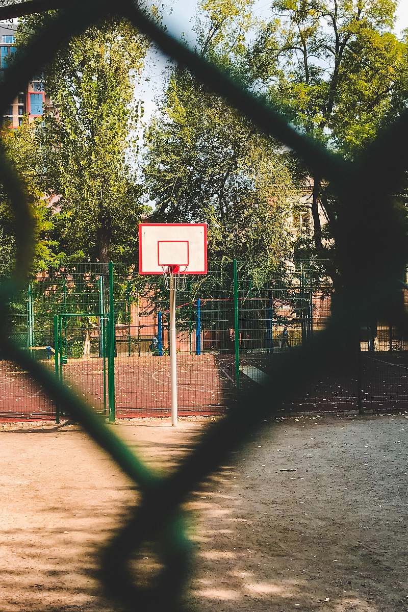 person white and red basketball hoop at daytime sport