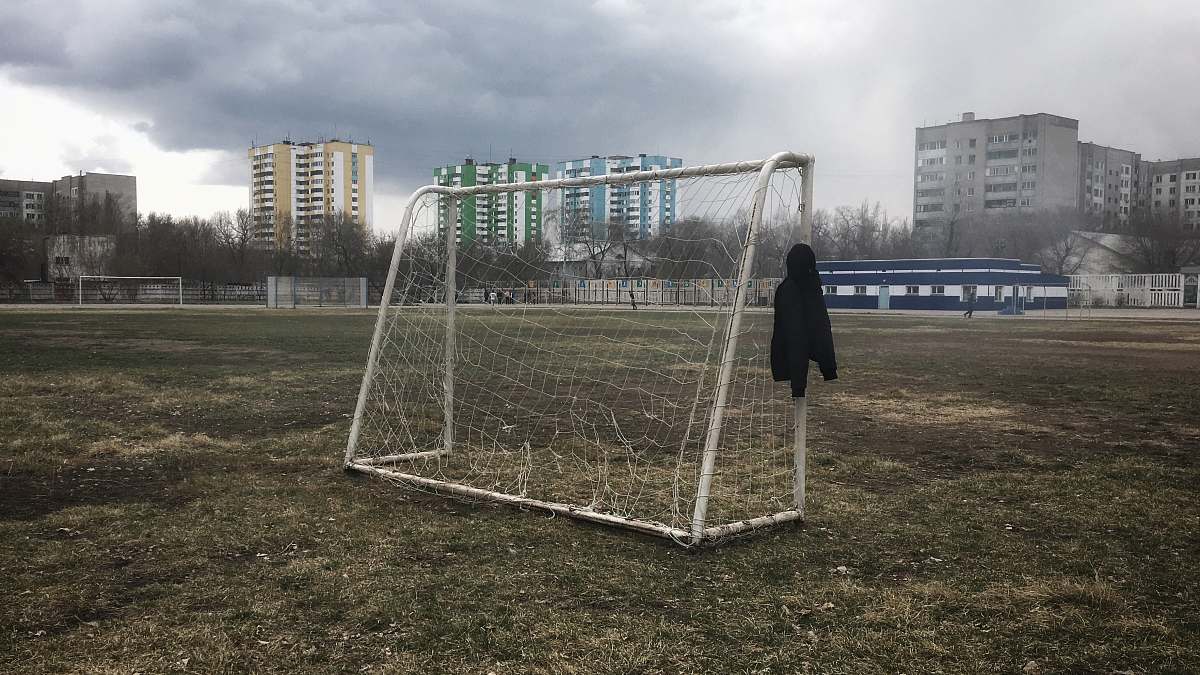 person white soccer net in field people