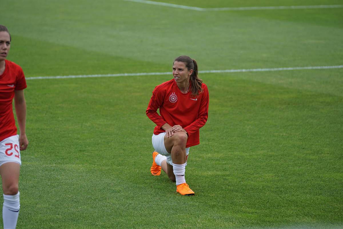 person woman on field people