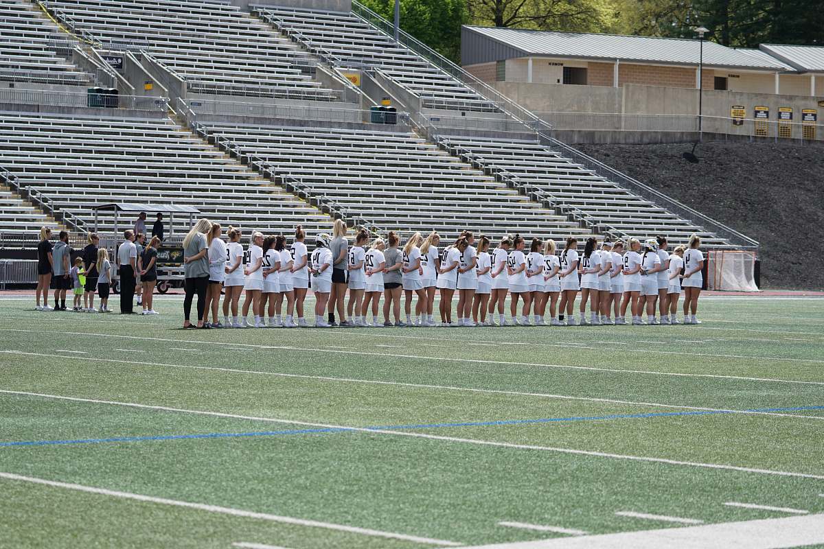 person women lined on football field field