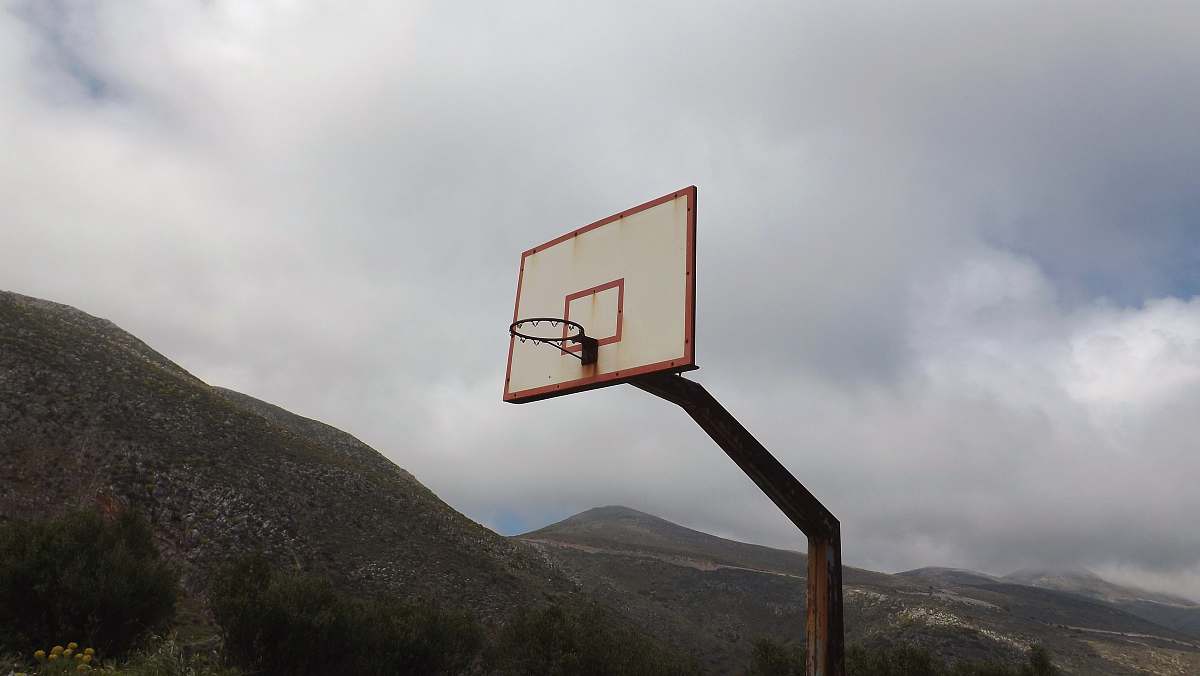 grey white and orange basketball hoop close-up photography vathia