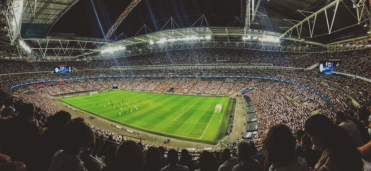 stadium crowd watching football game inside stadium crowd