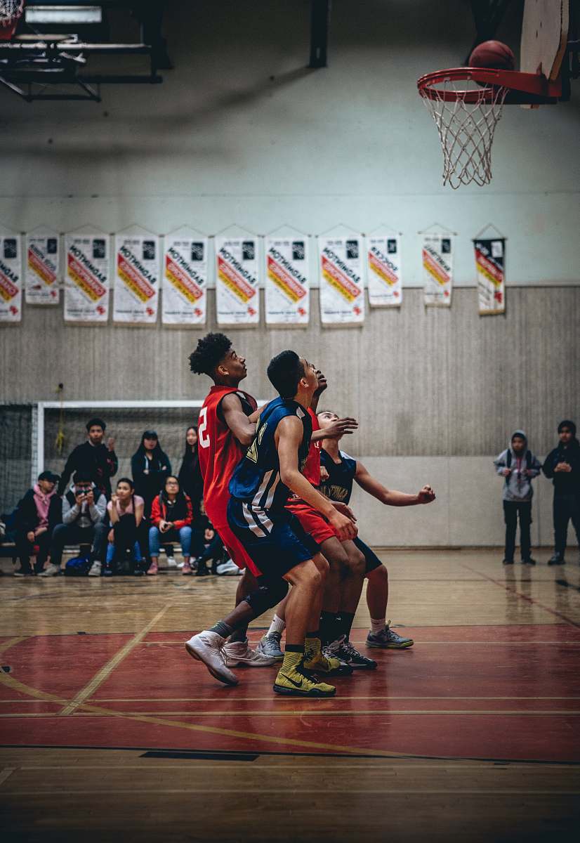 sport group of people playing basketball hoop